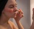 woman-looking-her-rosacea-mirror_11zon